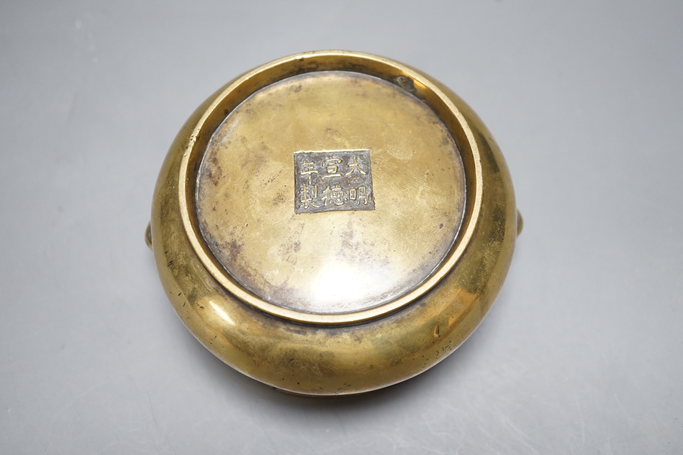 A Chinese bronze censer, Xuande mark, Qing period, 12cm handle to handle